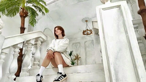 Sexy redhead college babe in tiny white shorts spreads legs teasing on grand white stairs