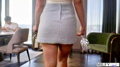 Jennifer White MILF in short gray skirt, teasing from behind