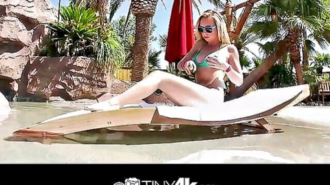 Hot blonde babe in green bikini lounging poolside, teasing for massive cock pounding