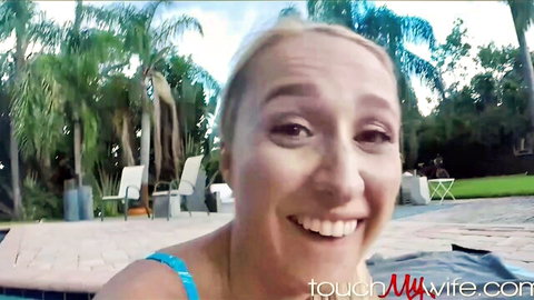 Smiling blonde wife in blue bikini by pool, teasing for cheating cumshot fun