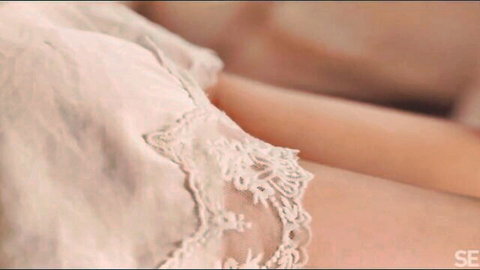 Mia Mi in seductive white lace lingerie, teasing thigh close-up