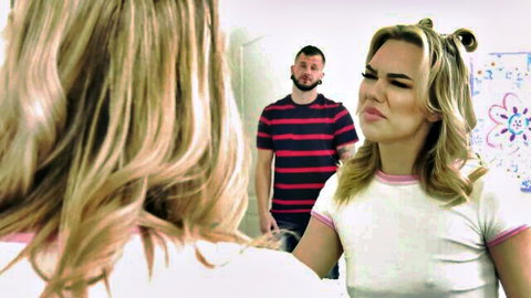 Pouting blonde stepsister in tight white tee confronts bearded stepbrother in kitchen taboo scene