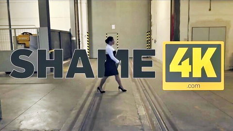 Brunette office babe in tight skirt and heels walks seductively in warehouse for Shame4K humiliation