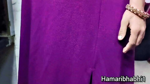 Indian cougar Devi in tight purple dress, teasing with curvy hips