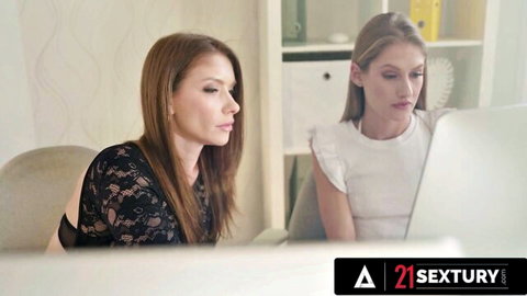 Tiffany Tatum and petite redhead in sexy office tops at desk