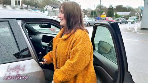 Chubby MILF in fuzzy orange coat opening car door in rainy parking lot