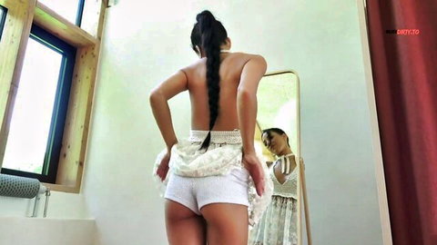 Sexy Asian teen lifts lacy skirt showing tight ass in white panties from behind in mirror