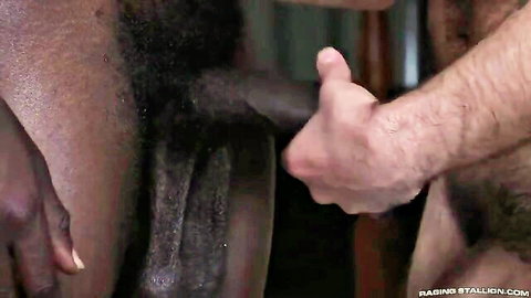 White hand gripping massive BBC cock in closeup handjob action