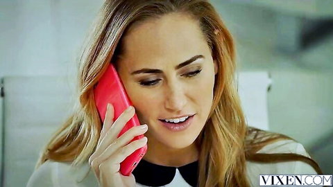 Carter Cruise on phone in sexy office blouse, blonde beauty smiling