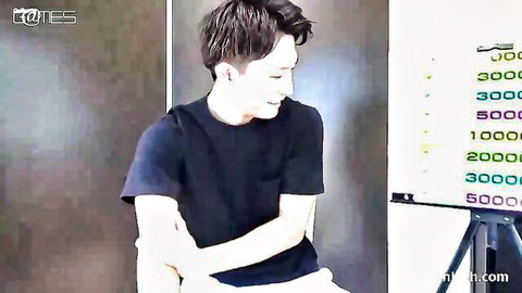 Smiling Asian stud in black t-shirt and shorts, teasing gay action