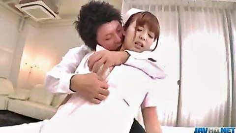 Ai Suzuki in nurse uniform embraced passionately by man in JAV scene