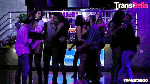 Diverse trans group partying in club, embracing before wild anal action