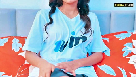 Seductive Indian Bhabhi in blue t-shirt and shorts on bed