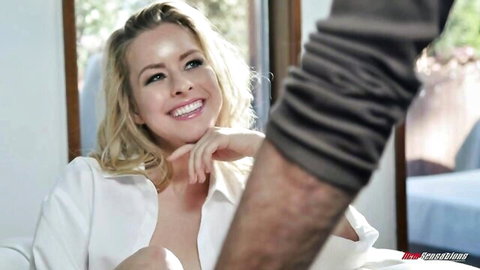 Blonde Lilly Lit smiles teasingly in open white blouse with stepdad's arm around her