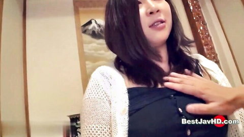 Sensual Japanese woman in white cardigan touched on chest by partner in JAV scene