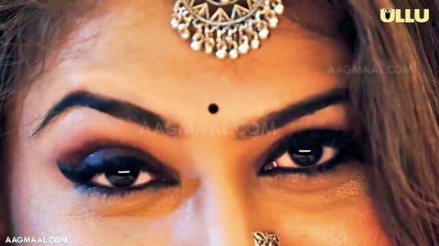Seductive Indian MILF Rain Basera with bindi and heavy eyeliner close-up