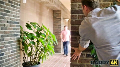 Stepdaddy in gray shirt glances back in hallway, Daddy 4K naughty scene