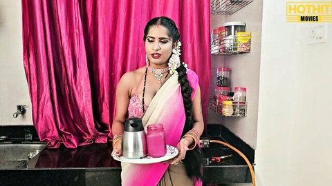 Sexy Tamil cougar in pink saree holding blender, teasing in kitchen