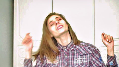 Brunette in plaid shirt tilts head back moaning in ecstasy with hands raised