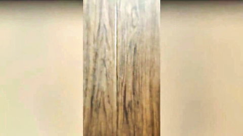 Close-up of light wooden floor planks with natural grain texture
