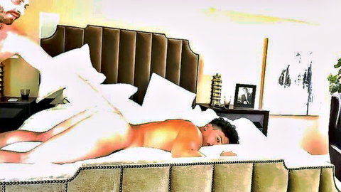 Naked muscular gay man lying seductively on bed exposing bare ass cheeks