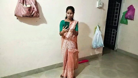 Desi Indian bhabhi in orange saree posing for sexy selfie video