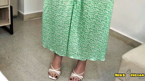 Curvy Indian MILF in green patterned dress and white strappy heels showing huge ass from behind