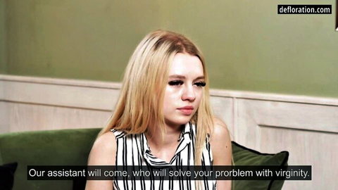 Blonde teen girl in striped top sits on couch awaiting virginity defloration by assistant cock