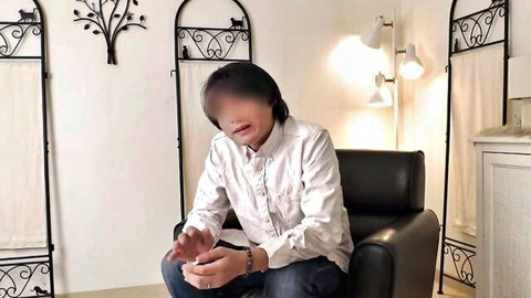 Blured face man in white shirt sitting sensually in black leather chair with hands clasped amateur homemade