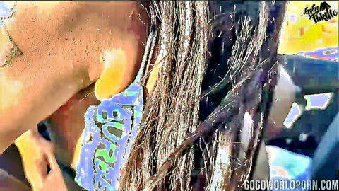 Gogo Fukme close-up with tattoos and earrings, hitchhiking tease