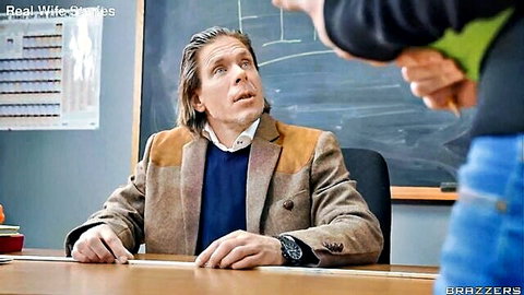 Shocked mature professor in tweed jacket surprised by woman grabbing him from behind at classroom desk