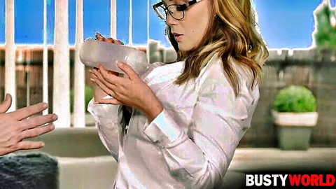 Blonde model Paola Guerra as slutty saleswoman in white blouse holding bowl outdoors