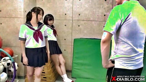 Two petite Japanese schoolgirls in sailor uniforms with male teacher, JAV school scene