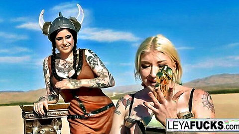Leya Falcon Viking cosplay with blonde babe, tattoos, desert outdoor tease