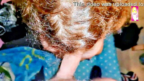 Redhead amateur wife bends over giving POV blowjob with hand on thigh in homemade video