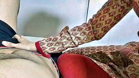 Indian Punjabi Aunty in red salwar kameez fondling man's cock