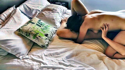Two nude lesbians scissoring with pussies grinding intensely on bed