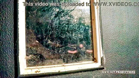 Scott Trainor as nosey neighbor peeking through steamy window in voyeur scene