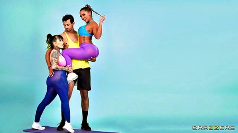 Muscular stud lifts ponytail babe by juicy ass while tattooed slut watches in tight gym wear
