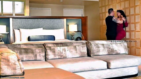 Drea Alexa in red dress embraces man passionately in bedroom