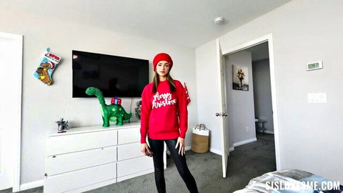Nikki Nicole posing in red Christmas sweater and beret for holiday tease