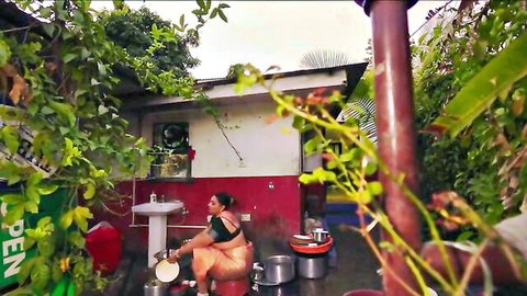 Curvy Indian babe in saree washing dishes outdoors, big tits visible