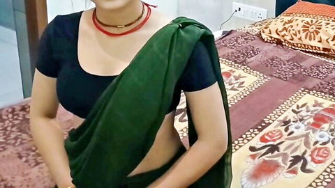 Sexy Indian bhabhi in green saree and black blouse posing seductively