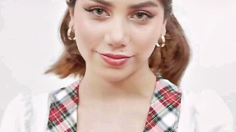 Marina Gold smiling in sexy plaid top, teasing close-up