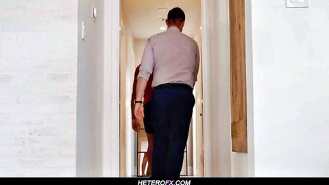 Pierce Paris leads Jack Bailey in red dress down hallway in steamy threesome