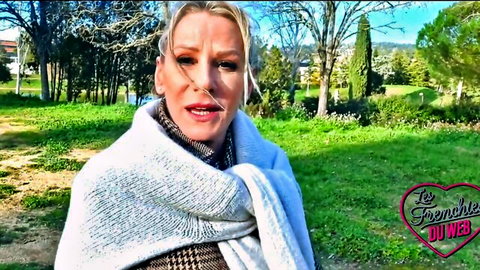 Mature blonde Victoria in cozy outdoor wrap, teasing expression