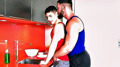 Muscular black stud embraces young twink in kitchen foreplay