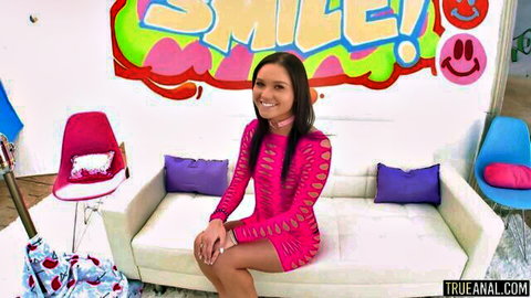 Zoe Bloom smiling in revealing pink cutout dress, fit petite Asian model