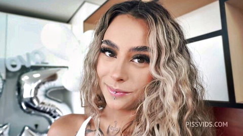 Jasminy Villar blonde beauty smiling in sexy white top at party