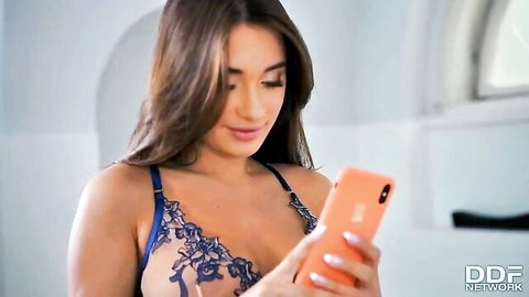 Hot 18yo brunette in blue lace lingerie holding phone, teasing tight body